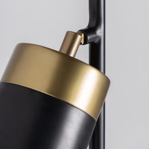 Lámpara de pie de estilo art deco fabricado en hierro en color oro combinado con latón en color negro.