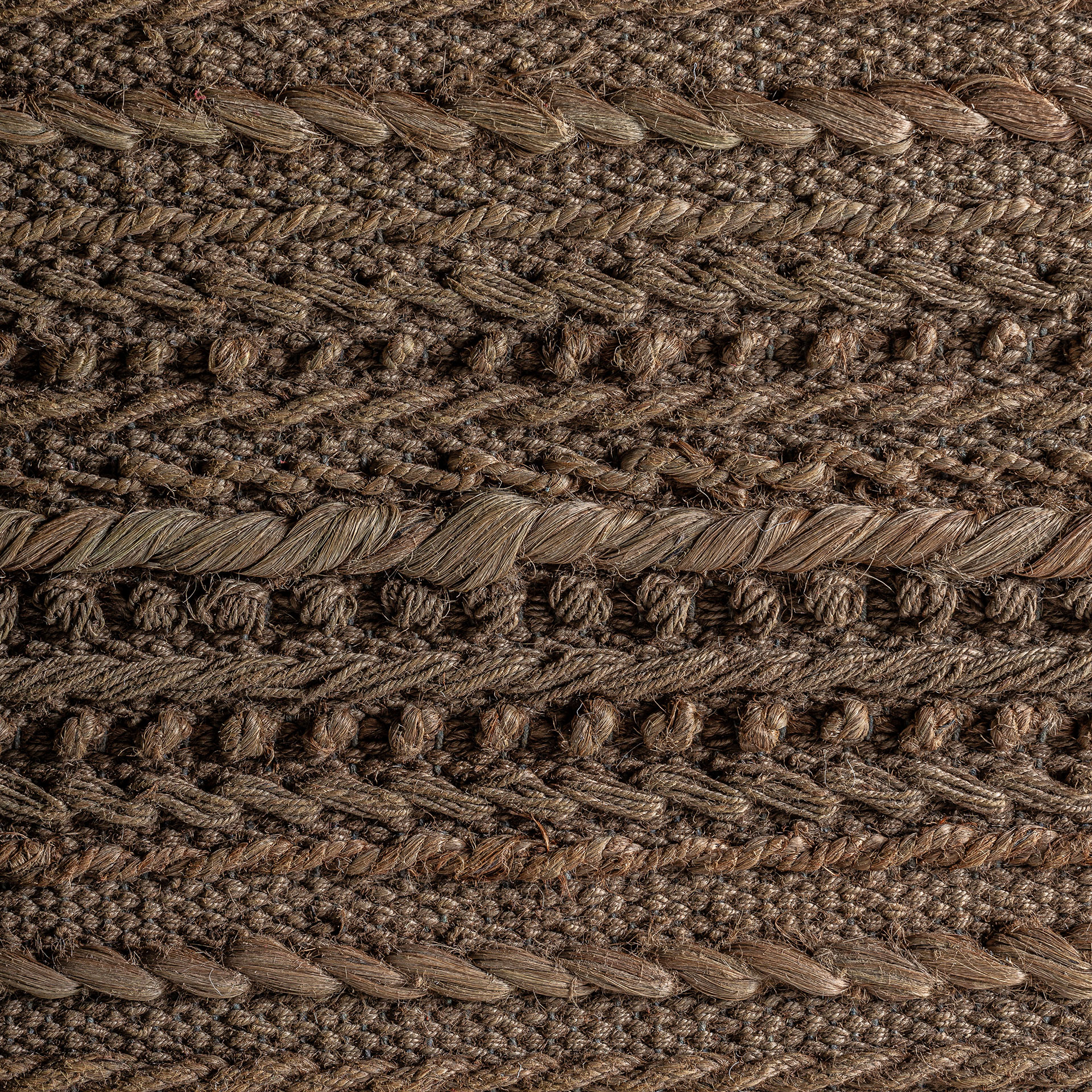 Lienzo Caliu de estilo boho fabricado en yute en color tonos en marrón combinado con algodón y madera de mango en color marrón.