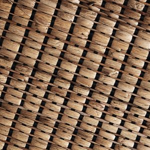 Panel decorativo Maurice de estilo boho fabricado en fibra natural en color marrón.